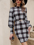 Black fitted midi dress with full lantern sleeves and decorative leather stitching detail.