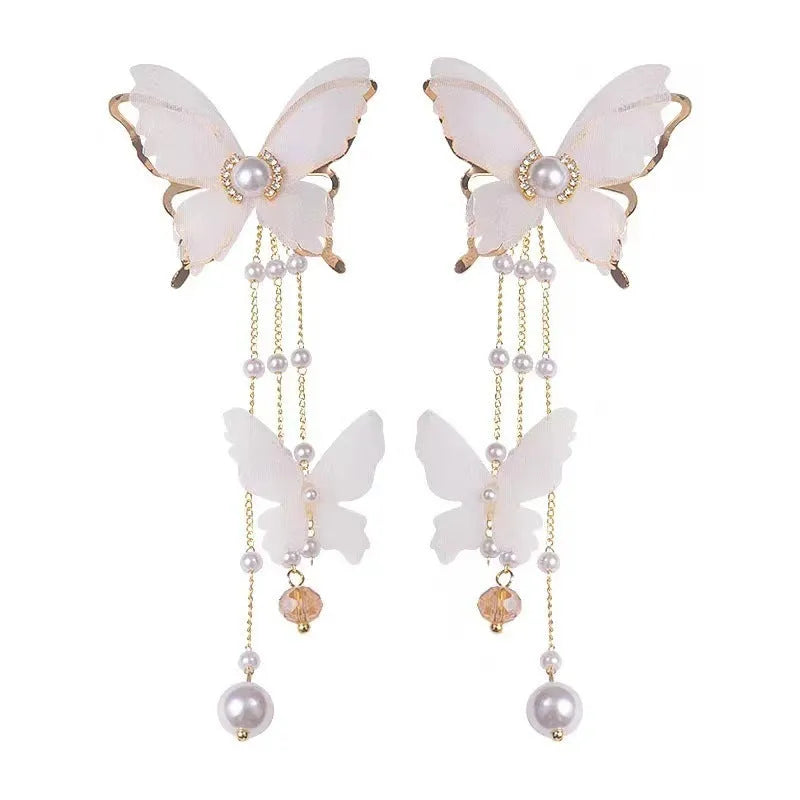 White electroplated butterfly tassel lace pearl rhinestone earrings with insect-shaped design
