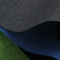 Black, blue, and green swatches of polyester Ant Cloth fabric on a roll.