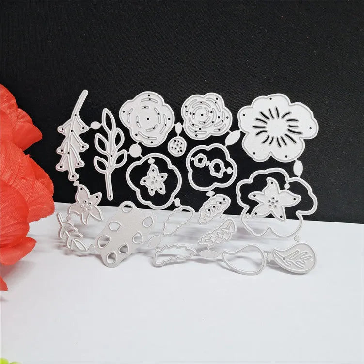 Silver carbon steel flower knife mold for paper cutting measuring 14.3 by 9.9 cm with etched plant design
