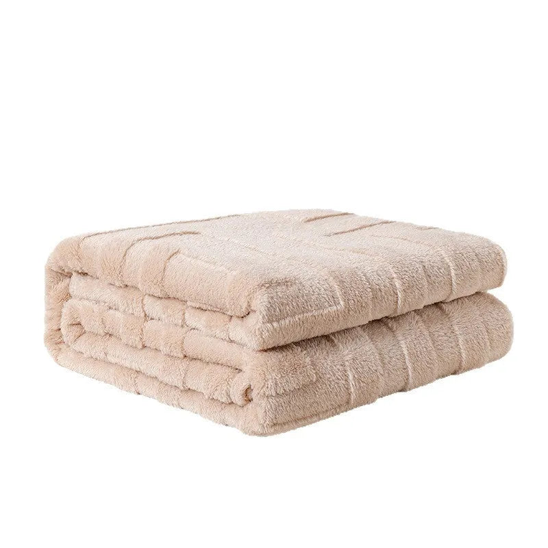 Thick coral fleece flannel sofa blanket in a solid colour, laid flat showing its texture.