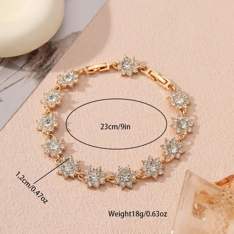 Flower-shaped bracelet with gemstone accents in gold or silver electroplated finish showing twelve colour combination options