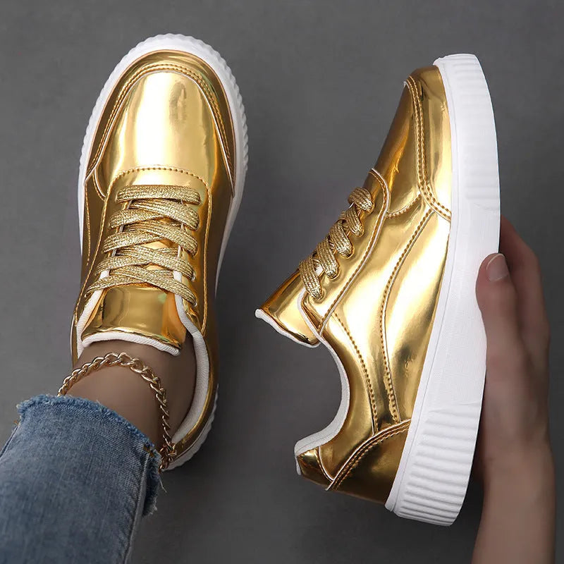 Gold platform sneaker with sequin upper and thick MD sole on a white background.