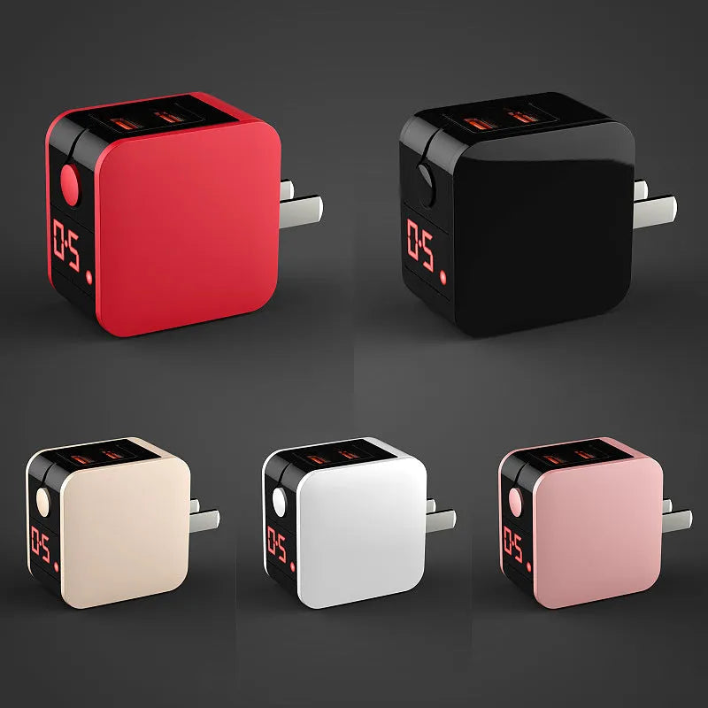 Black 5V2A travel power adapter with dual USB ports and digital display showing UK plug type