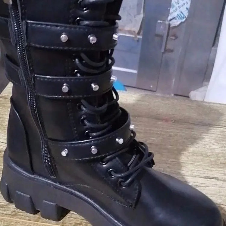 Women's black mid-calf buckle knight boots with side zip on a white background