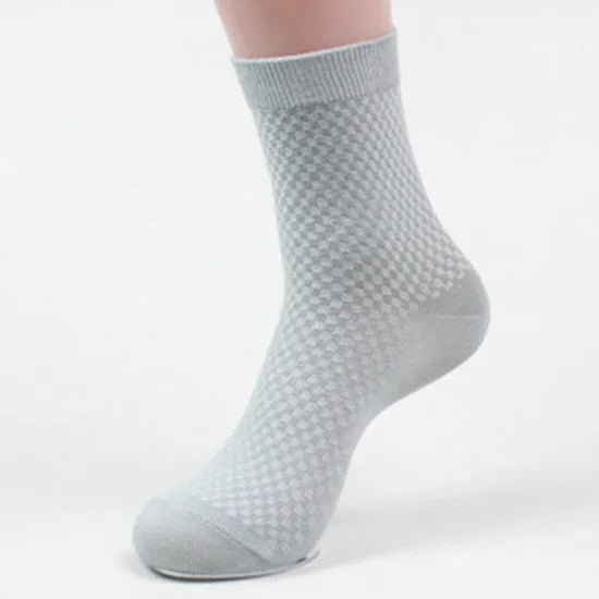 Men's black bamboo fibre socks with small square pattern on ankle