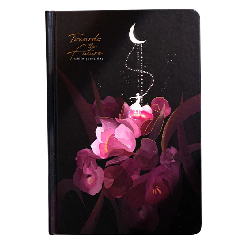 A5 notebook with luminous cover open to show colour illustrated pages, available in four colours.