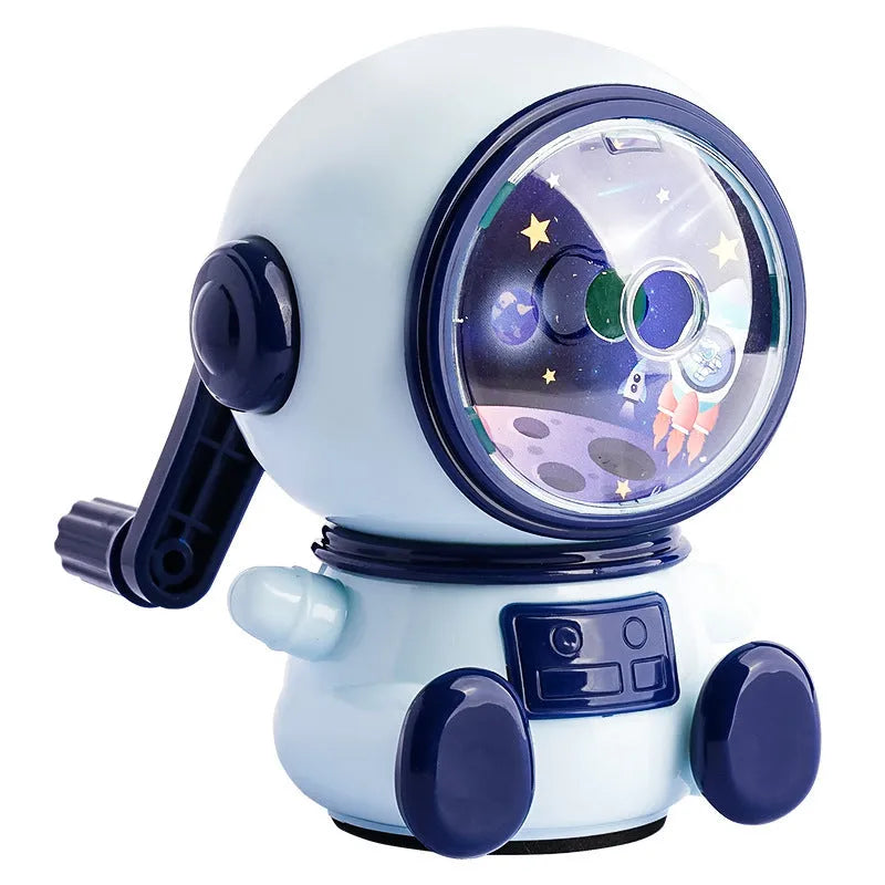 Blue cartoon astronaut manual pencil sharpener for children on a desk