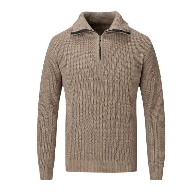 A man's loose-fitting slim pullover jumper in a solid colour, shown in a casual setting.