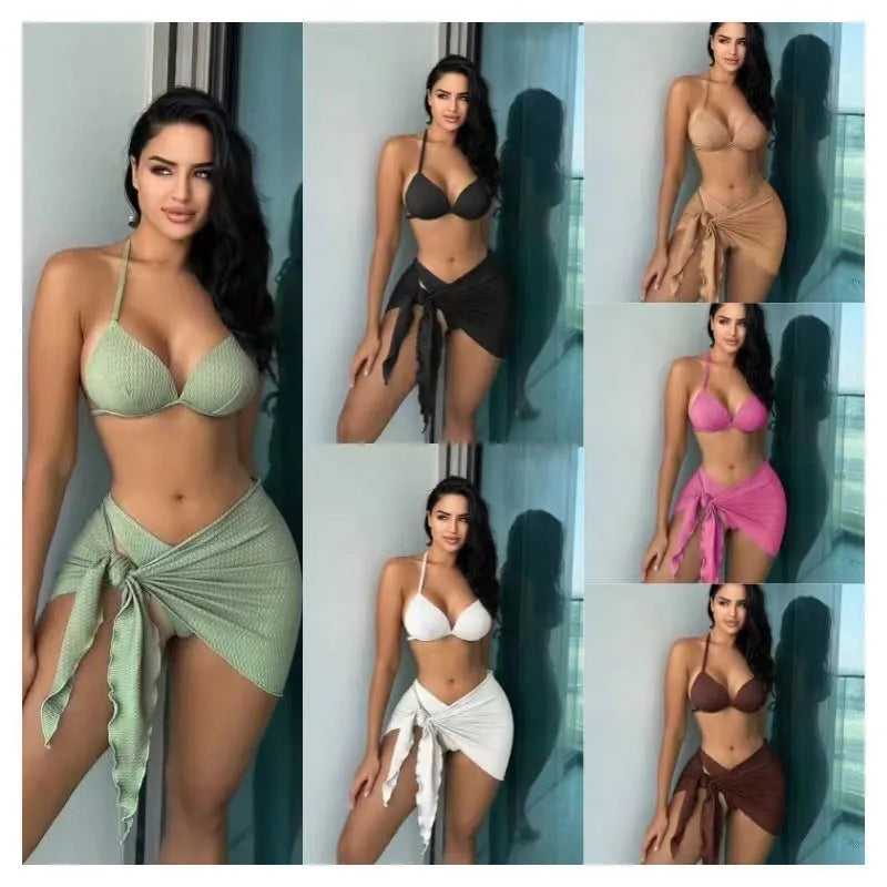 Women's black three-piece swimsuit set showing top, briefs, and skirt laid flat.