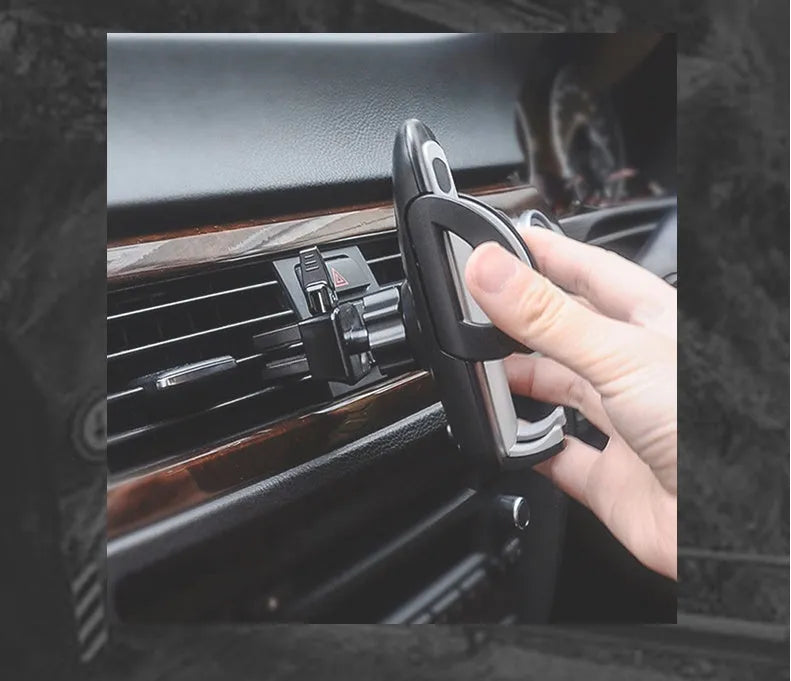 Black car air vent mobile phone holder mounted on vehicle air conditioning outlet