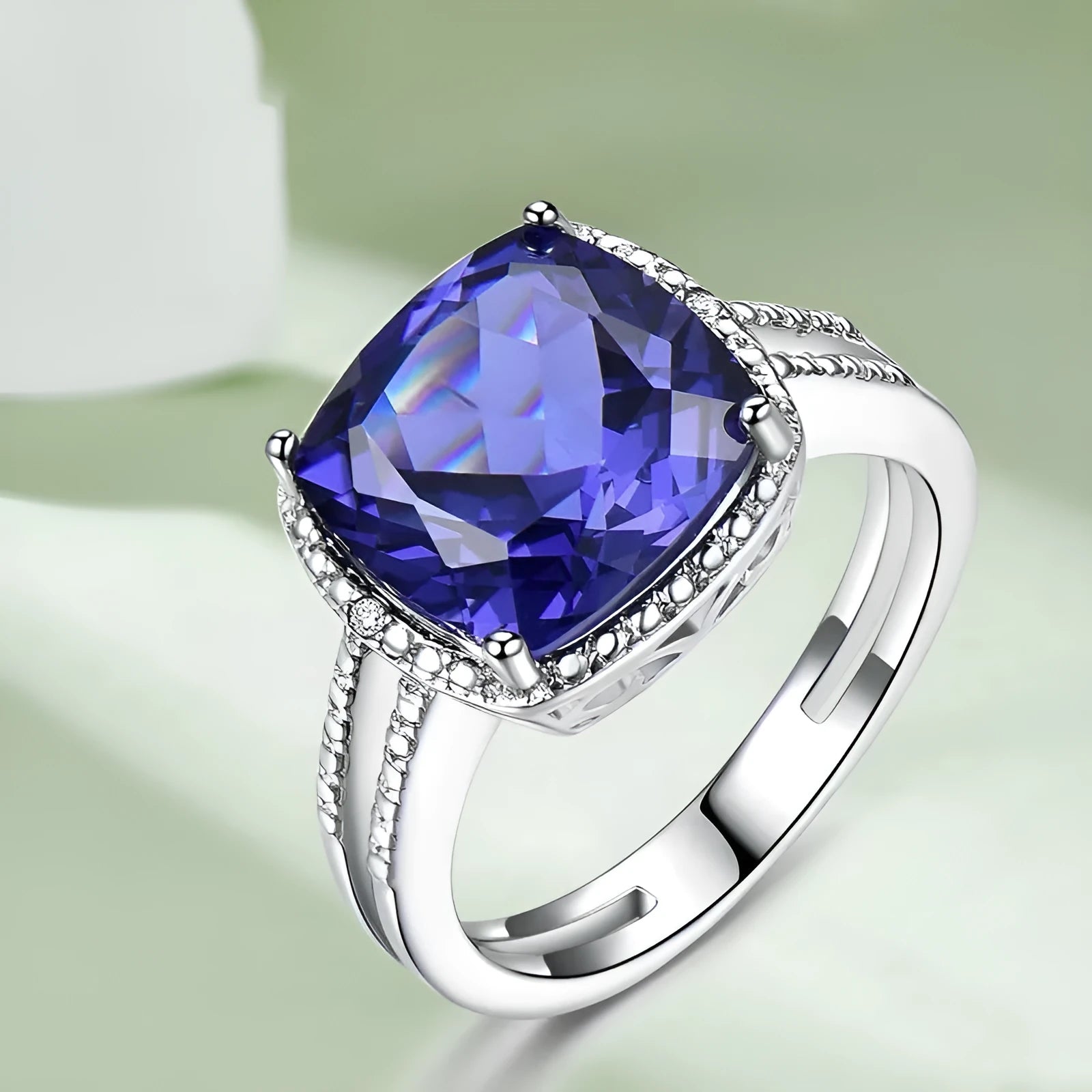 Blue tanzanite stone set in a sterling silver women's ring, shown in size 8.