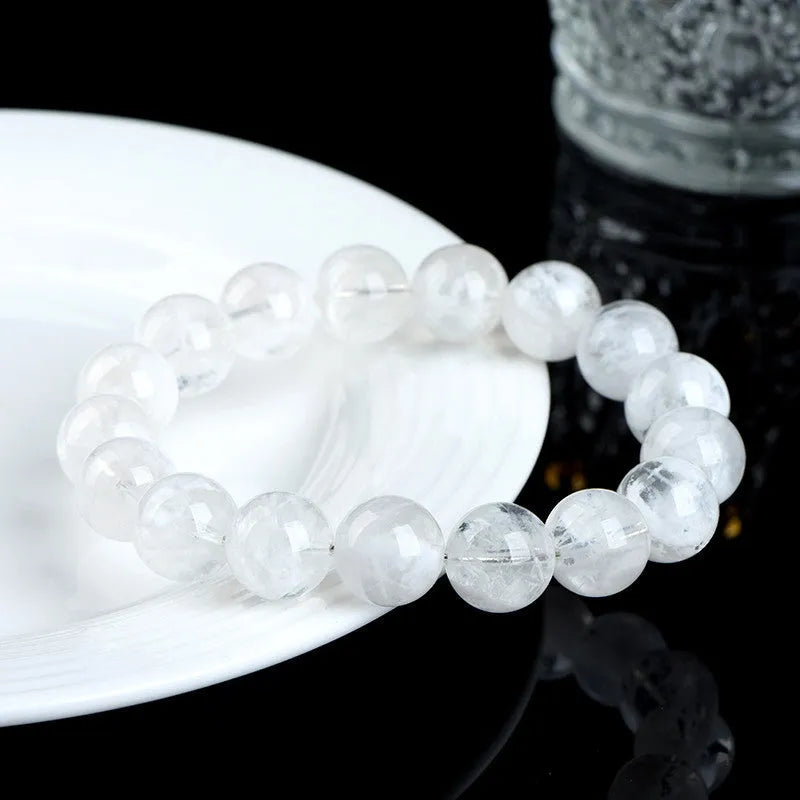 Natural crystal women's bracelet with blizzard snowflake round beads and geometric design featuring Ruyi Xiangyun elements