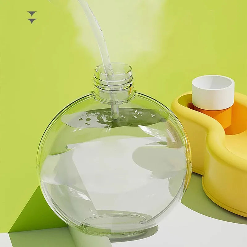 Green portable dog travel cup with integrated drinking bowl, showing 500ml capacity and leak-proof seal.