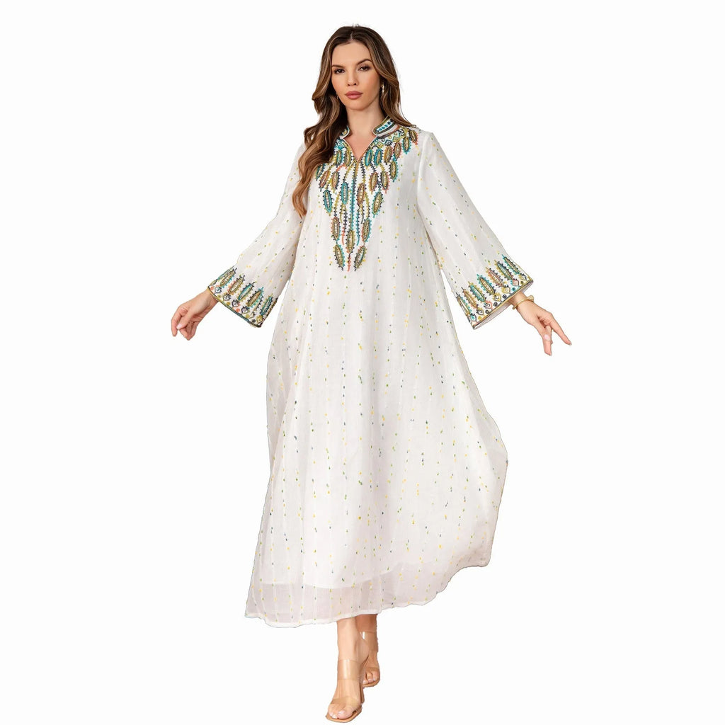 White Arabic robe for women with long sleeves and a floor-length skirt.