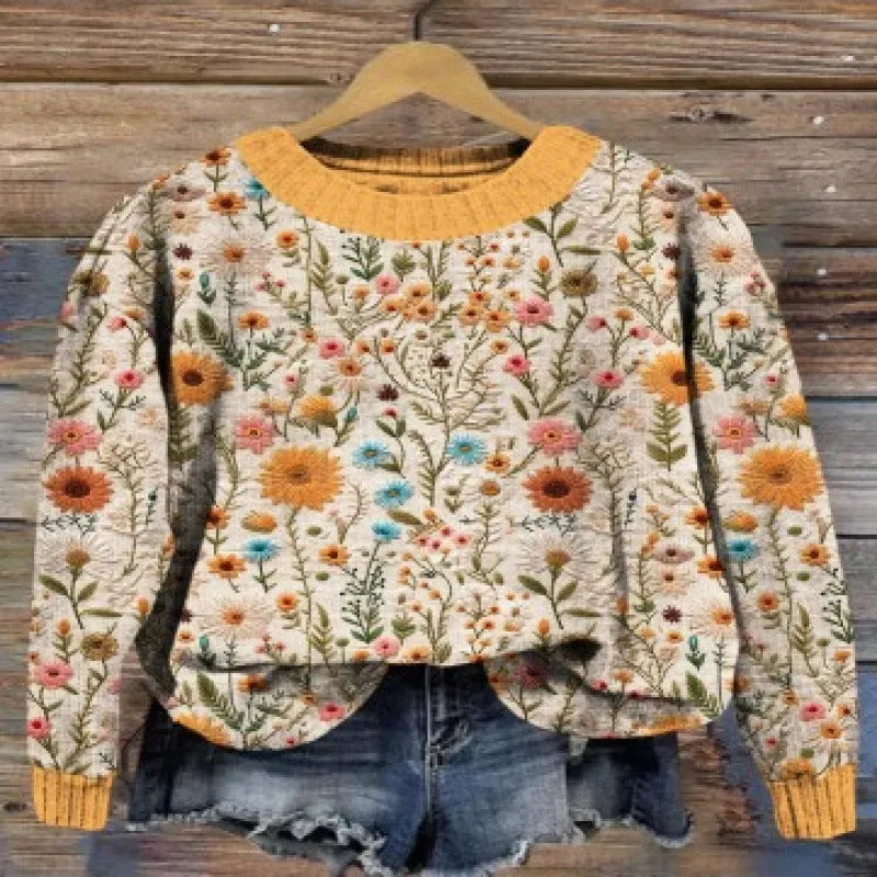 Round neck sweater with a small floral digital print pattern on the front.