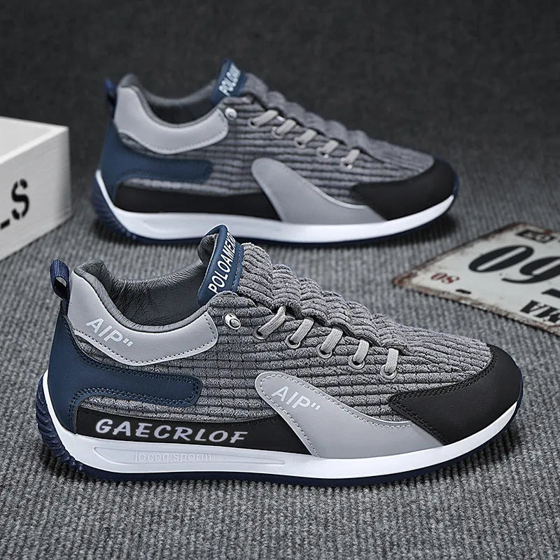 Men's grey and green mesh running shoes with round toe and lace-up closure shown in sizes 39-44