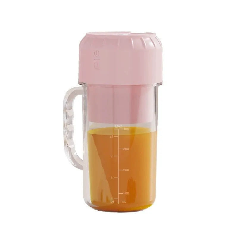 Portable USB juicer in cherry blossom pink or avocado green with plastic housing