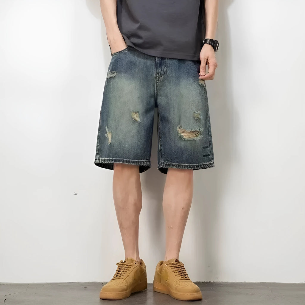 Blue retro distressed denim men's shorts with loose hole detailing and straight cut