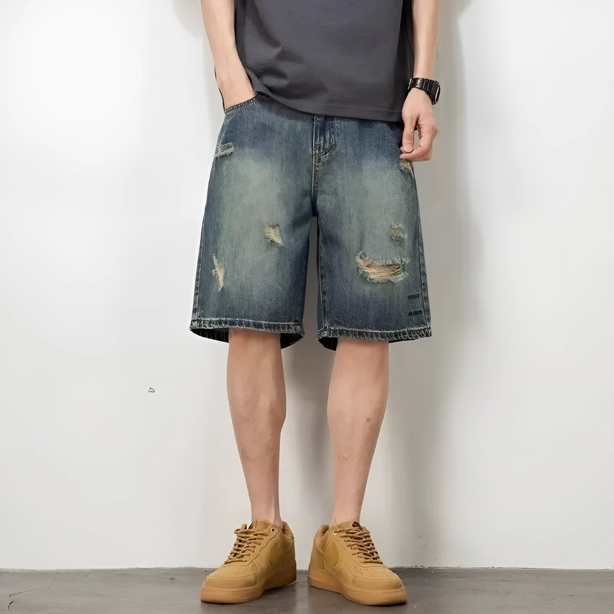 Blue retro distressed denim men's shorts with loose hole detailing and straight cut