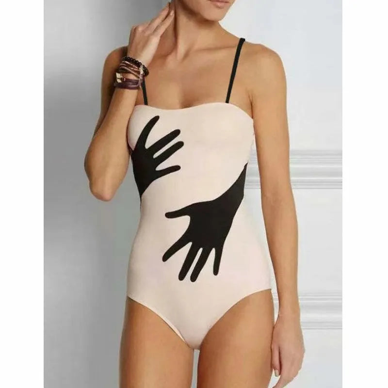 Women's patterned polyester bikini swimsuit with a long attached tulle skirt overlay.