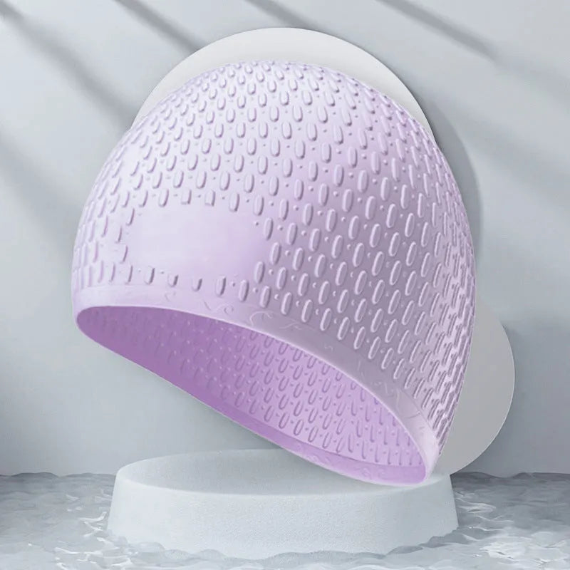 Silicone swimming cap for adults shown in one of nine solid colour options.