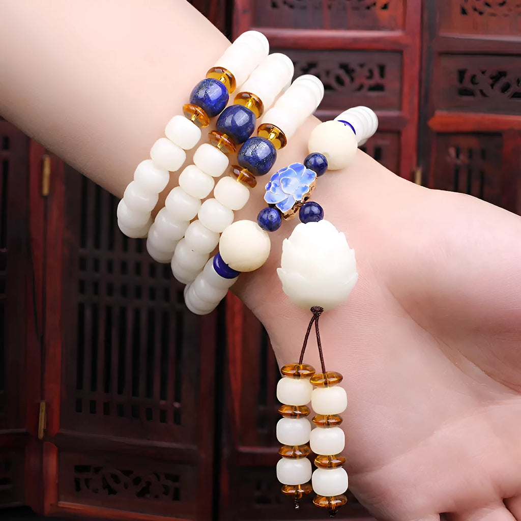 White jade Bodhi bead bracelet with 6x8mm beads in various decorative styles