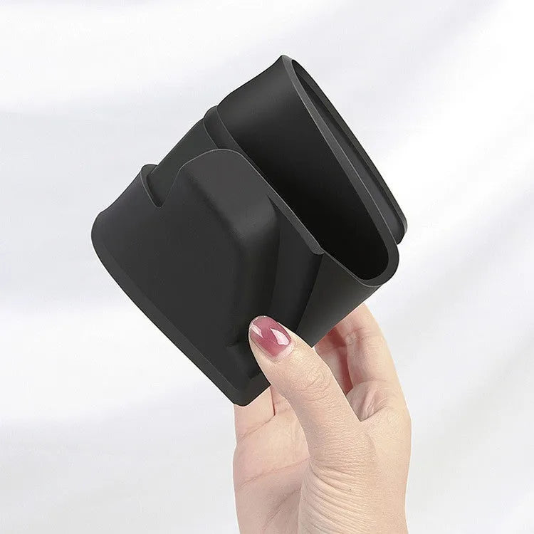 Black silicone glasses storage case mounted inside a Tesla Model 3/Y centre armrest console.