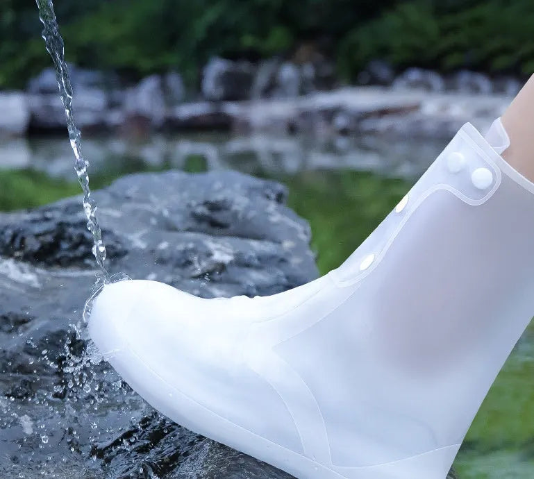 White high-top PVC reusable waterproof shoe cover shown on a foot, with size chart for S to 3XL.