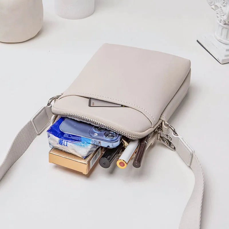 Small solid colour PU leather crossbody shoulder bag for women in beige, black, green, or khaki.