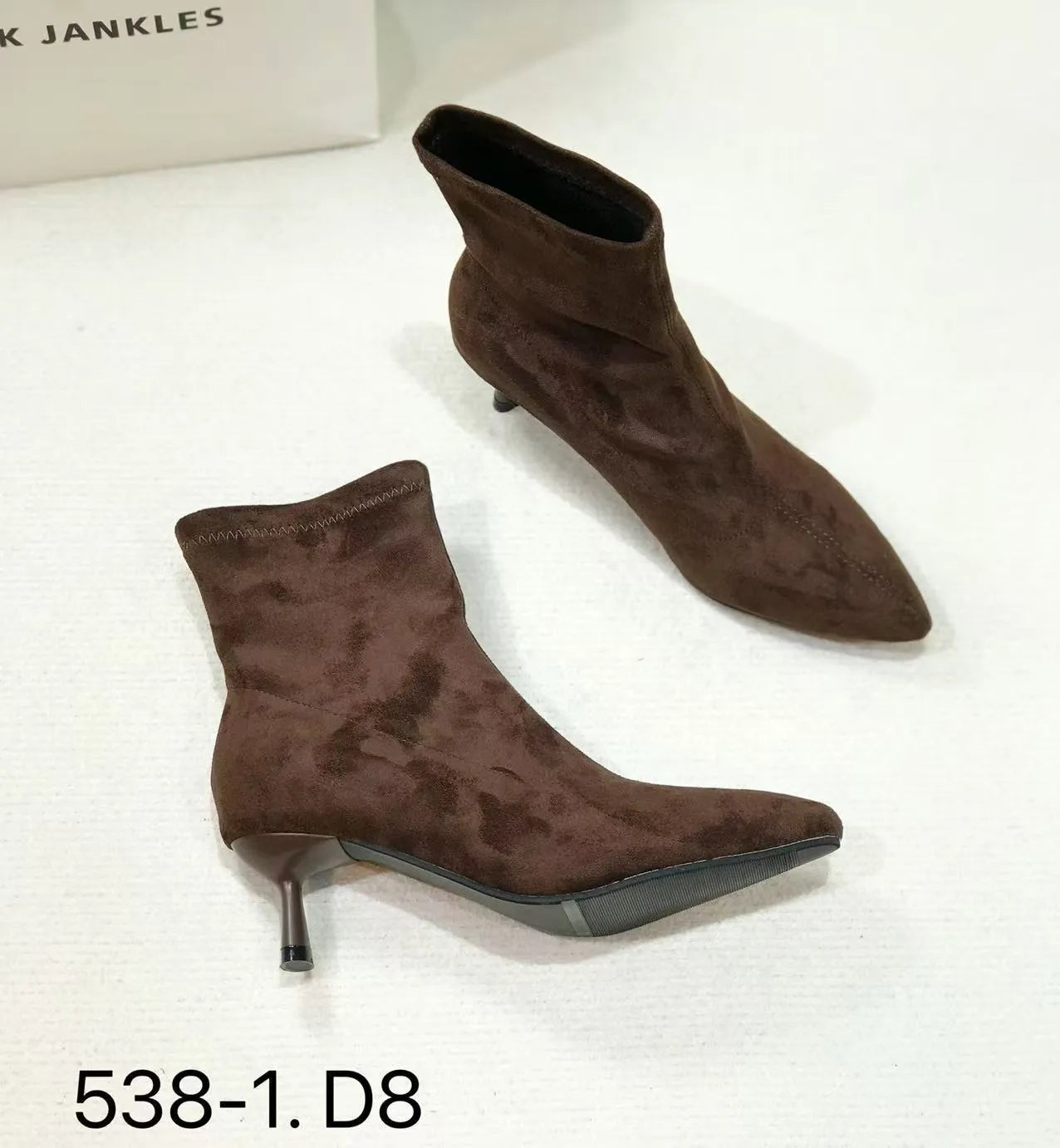 Women's black pointed toe ankle boots with stiletto heel and mid-calf length