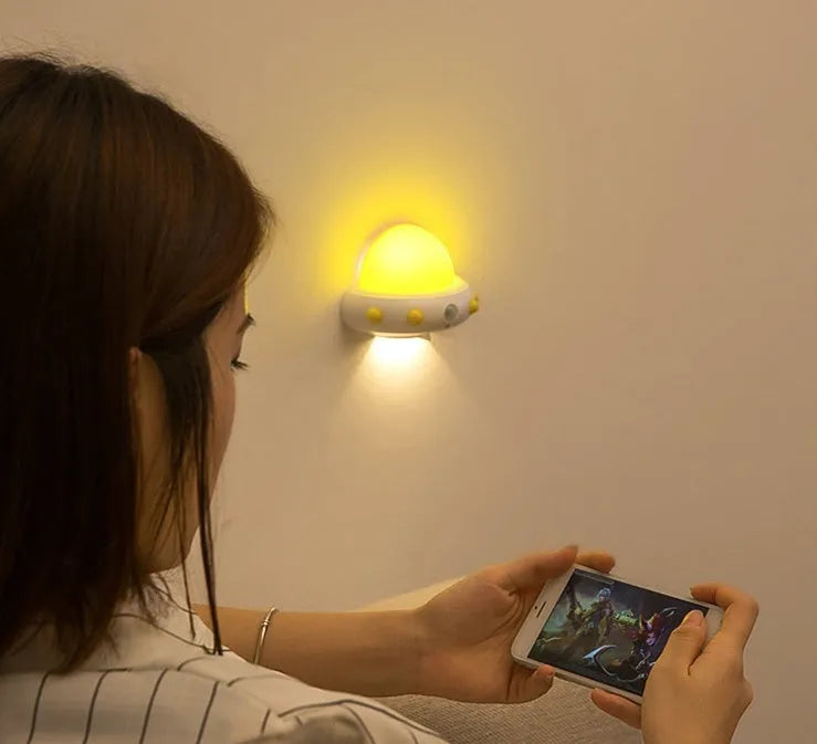 Blue remote control UFO shaped bedside night light with dimensions 105x76x58mm