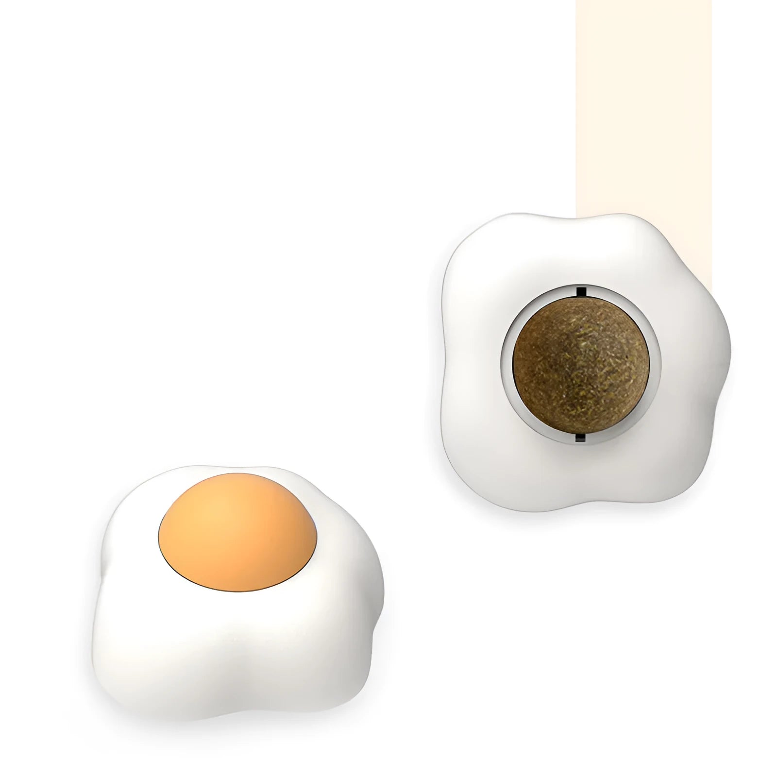 Interactive plush catnip ball toy stuck on a wall, showing Fried Egg and Poached Egg shape options.