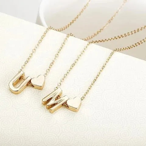 Peach heart shaped letter necklace pendant in alloy with gold and silver finish options