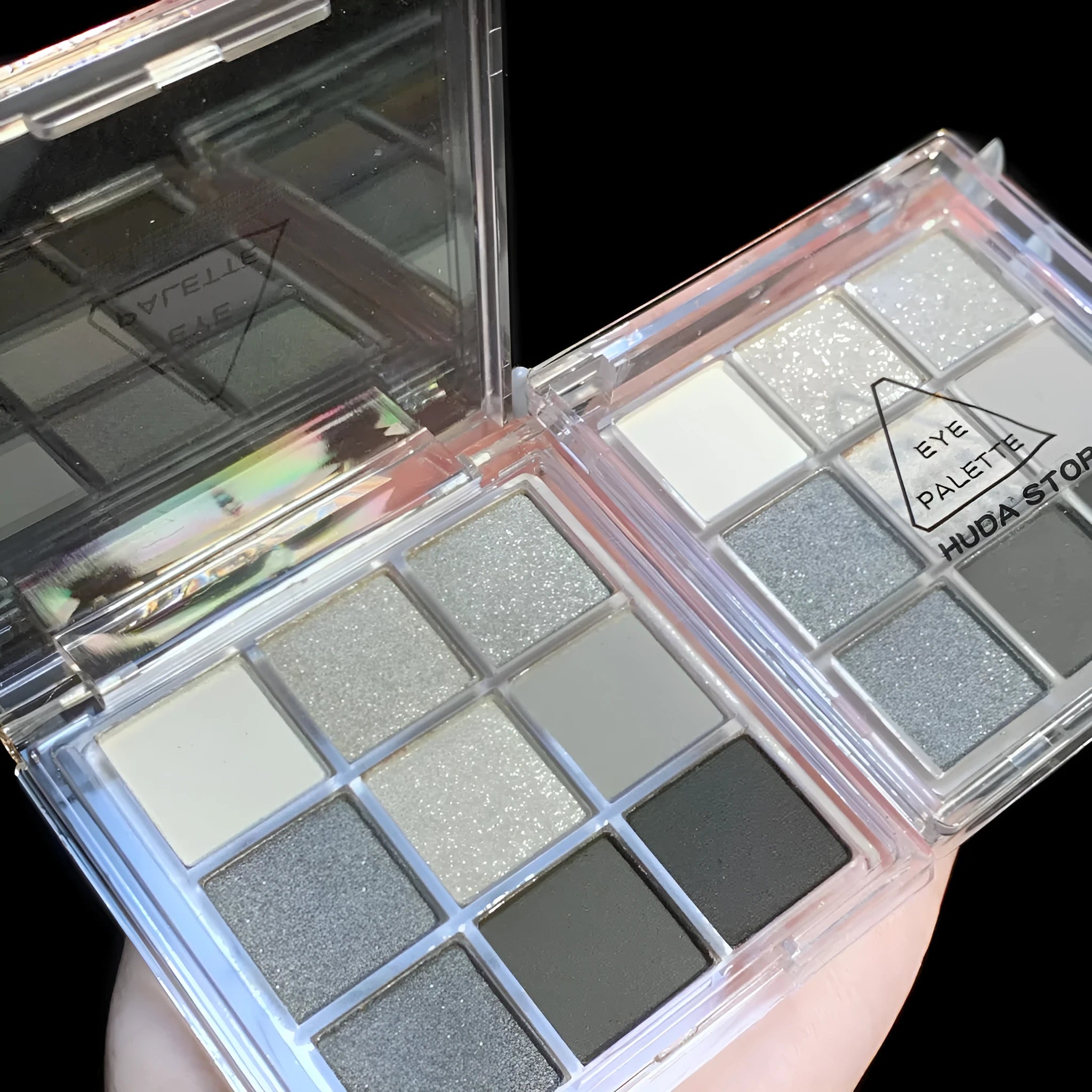 Smoked design nine-colour eye shadow palette showing white, silver, black, and iron grey shades