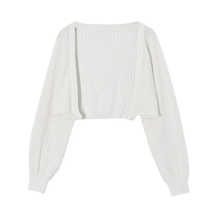 Women's hollow thin loose blouse with lantern sleeves in apricot colour showing slim fit and hollow-out detailing
