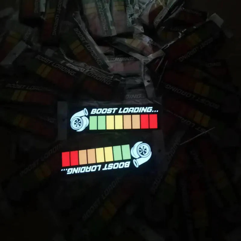 White glowing illuminated car window sticker with driver and cable on a vehicle.