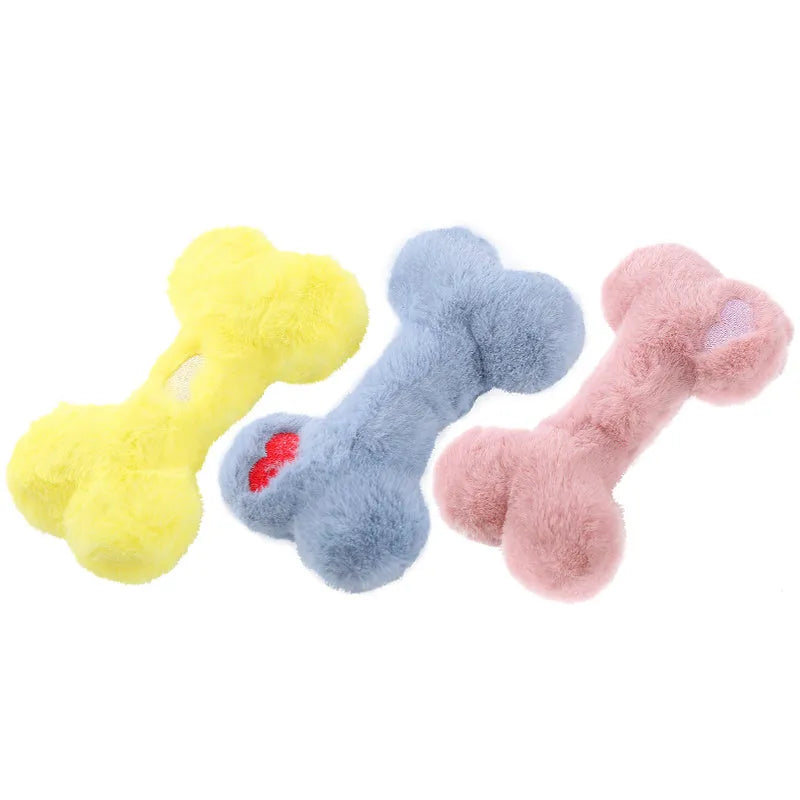 Soft plush dog toy shaped like a bone with a love heart design, in blue colour with a squeaker.
