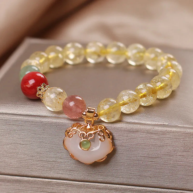 Women's alloy bracelet with a yellow hair crystal jade ruyi pendant charm.