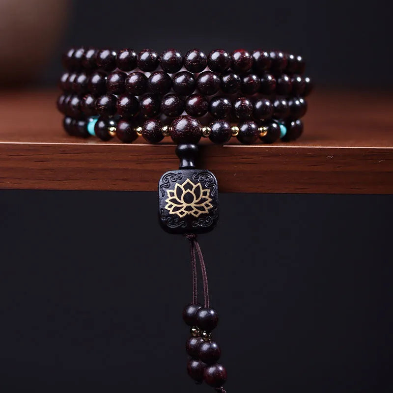 Zambian rosewood bead bracelet with flat lotus pendant showing 108 individual 0.6cm wooden beads