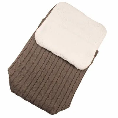 Envelope-style baby stroller sleeping bag in beige colour showing thick cotton wool filling and soft lining.