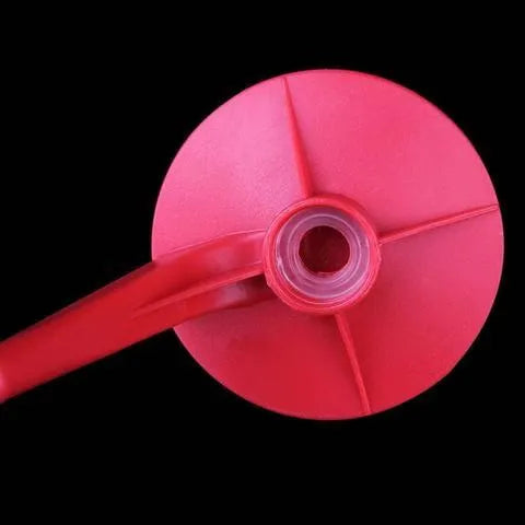 Red Magic Tap soda dispenser attached to 2-litre bottle with push-in mechanism for drink serving