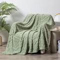 Shu cotton velvet jacquard blanket showing plant flowers pattern in fog blue colour