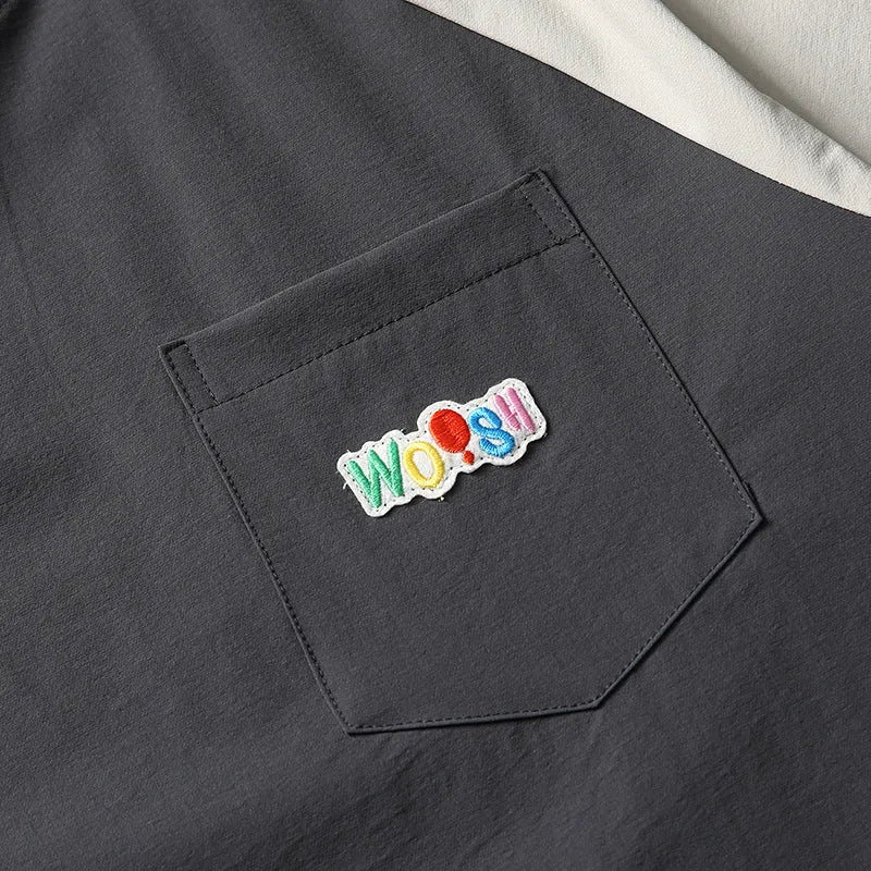 Dark grey loose fit men's T-shirt with contrast colour raglan short sleeves.