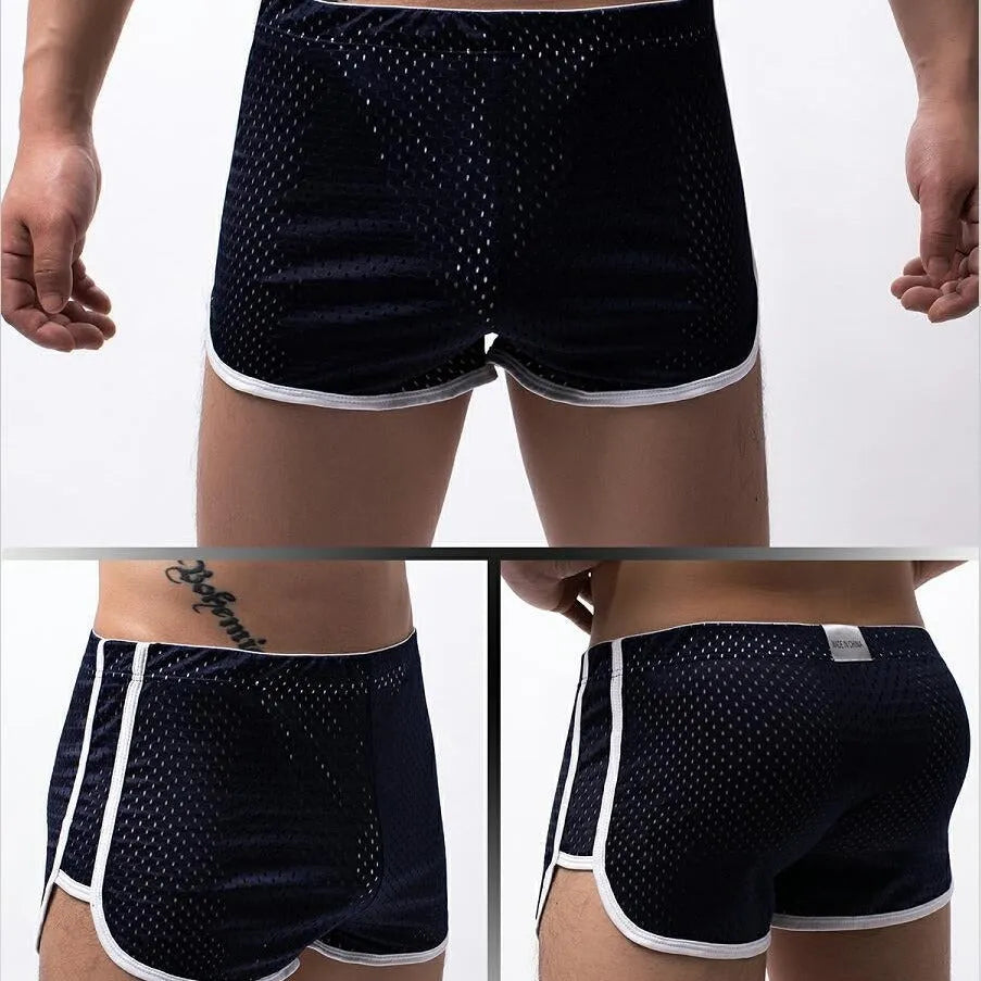 Men's three-point boxers in black, grey, blue, and white on a mid waist mannequin.