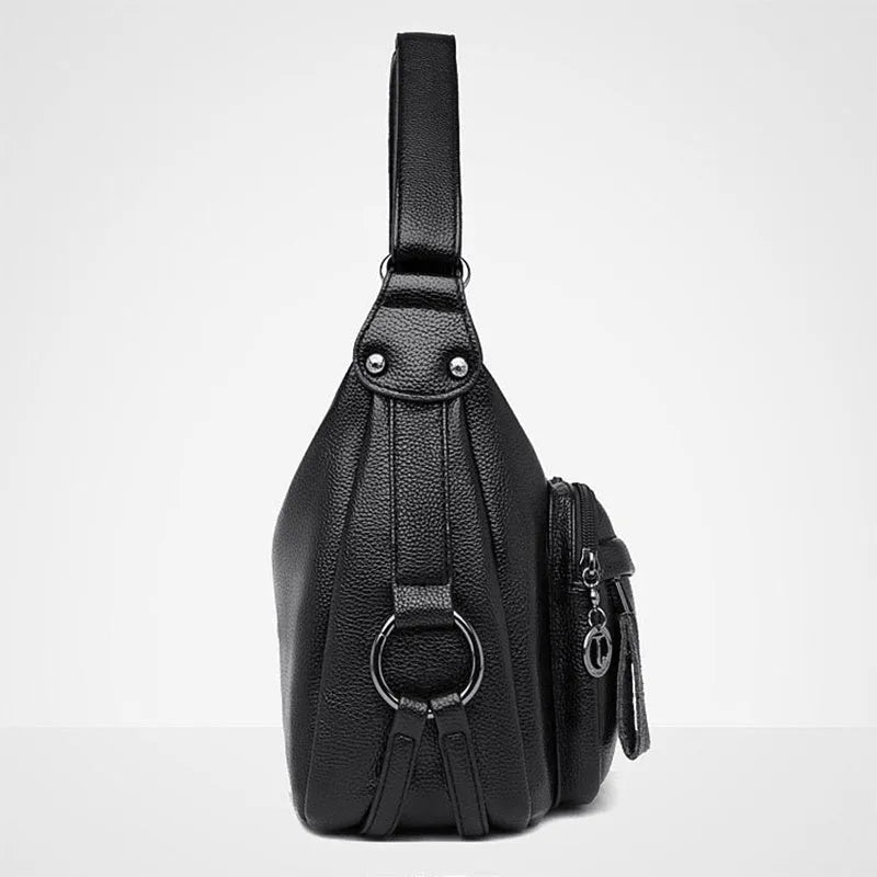 Large black or blue PU crossbody bag with organised internal compartments and soft handle
