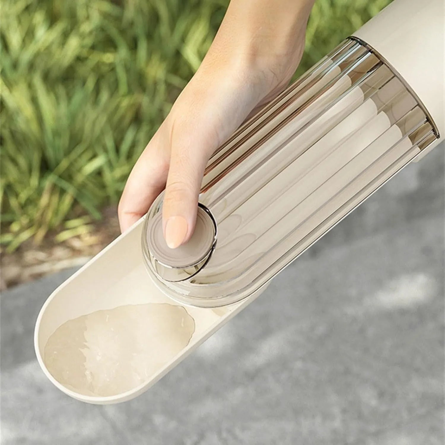 Folding dog water bottle with food dispenser in beige or green for outdoor pet activities