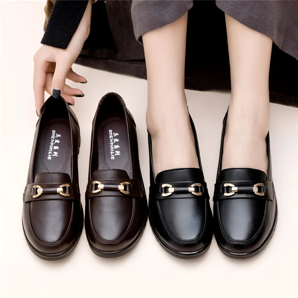 Black casual pumps with soft rubber sole and microfibre upper, shown on a plain background.