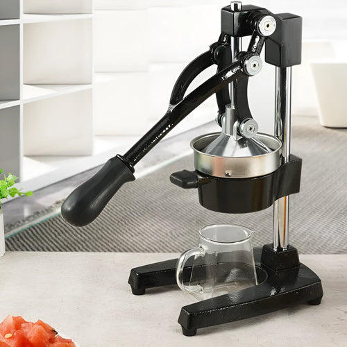 Black and white manual cast iron citrus juicer with stainless steel strainer, 40cm tall.