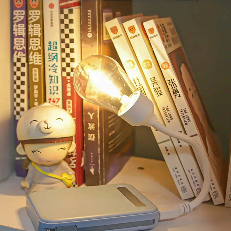 USB rechargeable folding night light with glowing tungsten S14 filament bulb